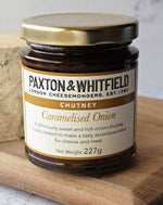 close up of paxton and whitfield caramelised onion chutney on wooden cheeseboard