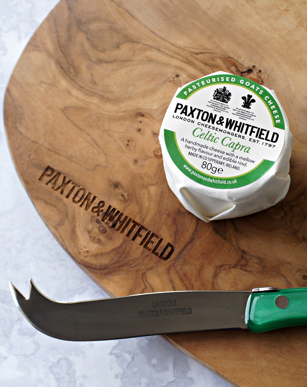 celtic carpa goats cheese on a paxton and whitfield wooden cheeseboard with cheese knife