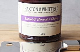 jar of beetroot and horseradish chutney with cheese knife on paxton and whitfield cheeseboard