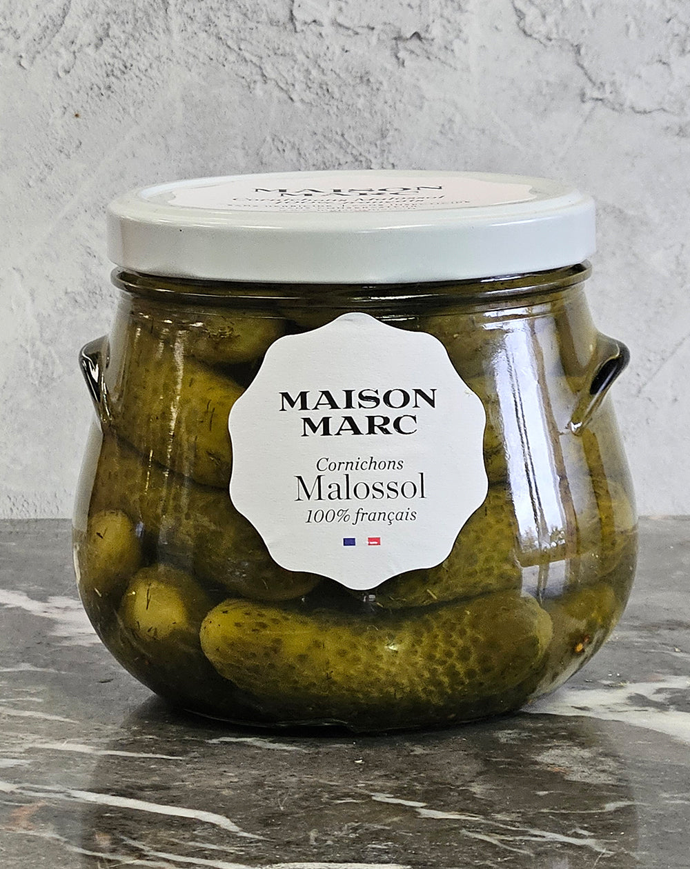 glass jar of french cornichon malossol