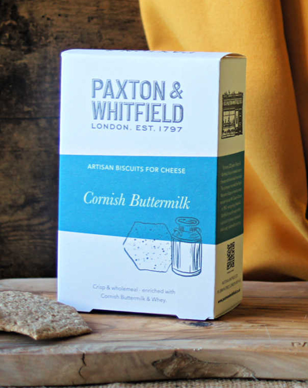 box of paxton and whitfield cornish buttermilk artisan biscuits on wooden cheeseboard