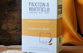 box of paxton and whitfield farmhouse butter artisan biscuits on wooden cheeseboard