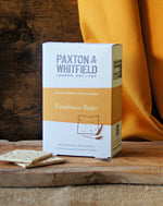 box of paxton and whitfield farmhouse butter artisan biscuits on wooden cheeseboard