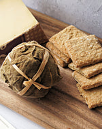 image showing leaf shell of fig ball on a paxton and whitfield wooden cheeseboard