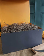 Luxury grey hamper box with orange inner and brown stuffing